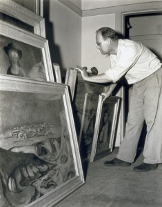 Photograph of Australian painter Russell Drysdale (at the National Portrait Gallery) with some canvases, taken by Max Dupain (1945)