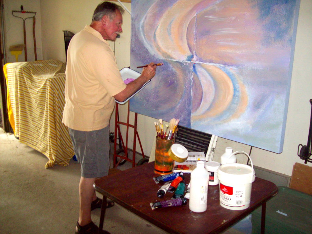 Artist, Richard Burton painting in his garage.